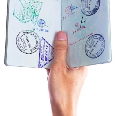 cropped-hand-businessman-holding-passport-against-white-background_1048944-8785357