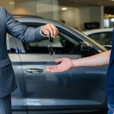 seller-passes-keys-new-car-young-family-buying-new-car_180601-9775