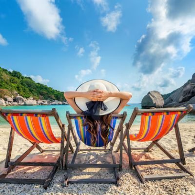 woman-with-hat-sitting-chairs-beach-beautiful-tropical-beach-woman-relaxing-tropical-beach-koh-nangyuan-island_335224-1110